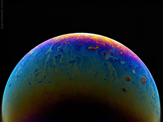 Illustration for article titled Photos of Soap Bubbles that Look Like Trippy Exoplanets
